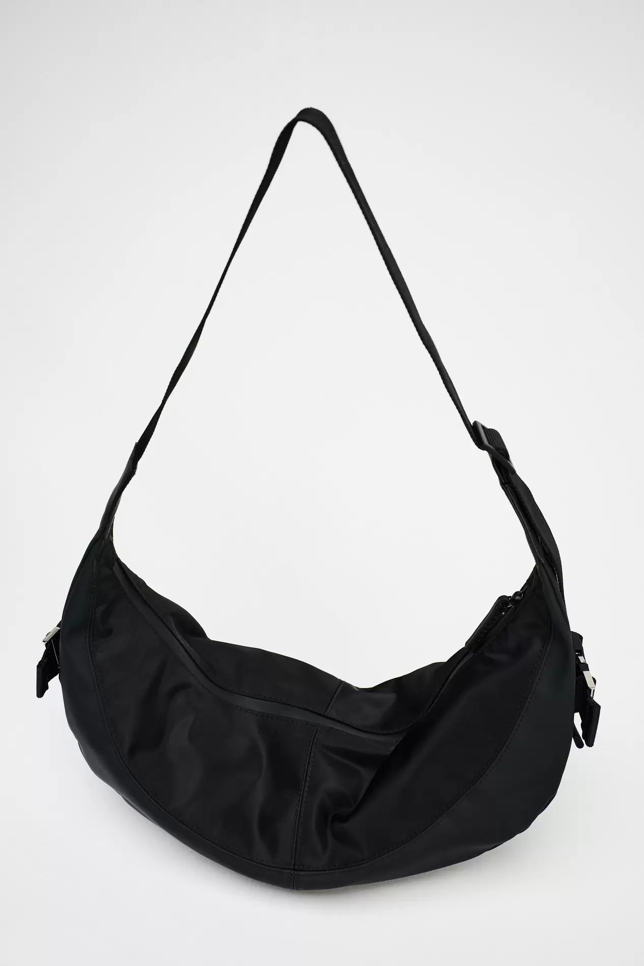 RUBBERIZED EFFECT OVAL SHOULDER BAG offers at $69.9 in ZARA