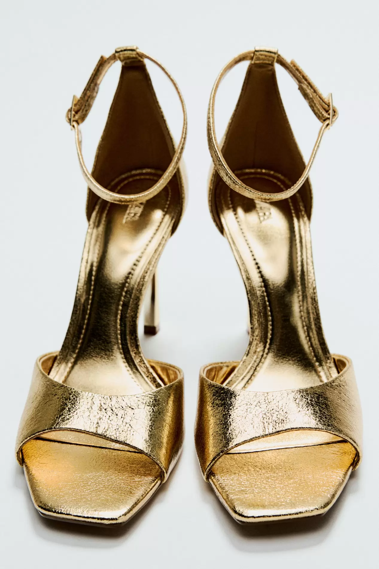 METALLIC EFFECT HEELED SANDALS offers at $59.9 in ZARA