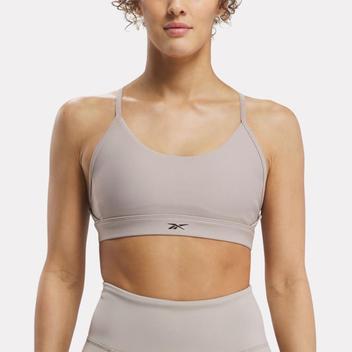 Lux strappy sports bra offers at $55 in Reebok