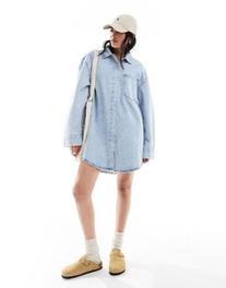ASOS DESIGN denim mini shirt dress with front pockets in bleach wash offers at $49.99 in Asos