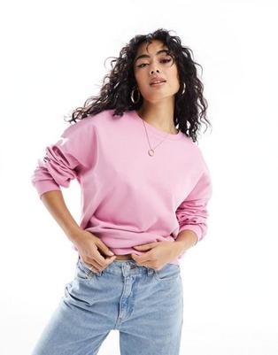 ASOS DESIGN oversized sweatshirt in bright pink offers at $24.99 in Asos