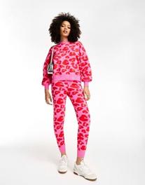 Never Fully Dressed leopard knitted sweatpants in pink and red - part of a set offers at $137 in Asos