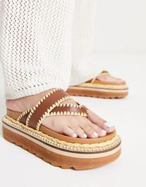ASOS DESIGN Fiesta leather toe thong platform flat sandals in brown offers at $45.5 in Asos
