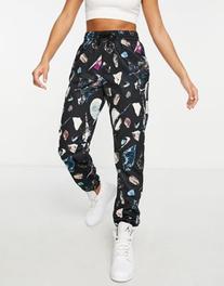 Nike Basketball Dri-FIT all over print sweatpants in black offers at $57 in Asos