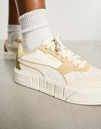 PUMA Cali Court sneakers in white with neutral detail offers at $55.25 in Asos
