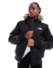 The North Face Arctic bomber jacket with faux fur trim in black offers at $225 in Asos