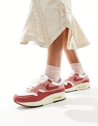 Nike Air Max 1 sneakers in red and coconut milk offers at $84 in Asos