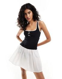 ASOS DESIGN square neck bow mini dress with contrast taffeta skirt in mono offers at $44.99 in Asos