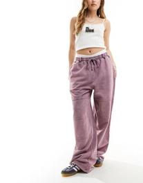 ASOS DESIGN straight leg sweatpants with seam details in pink acid wash offers at $39.99 in Asos