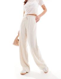 Stradivarius linen look pull on pants in natural offers at $35.9 in Asos