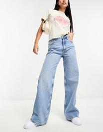 Pull&Bear mid rise wide leg jeans in medium washed blue offers at $47.9 in Asos