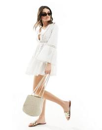 Miss Selfridge beach broderie lace insert fluted sleeve cover up mini dress in white offers at $65 in Asos