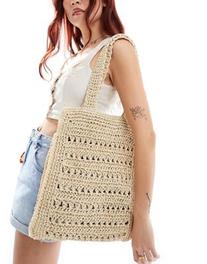 ASOS DESIGN straw hand crochet square tote bag with open weave offers at $39.99 in Asos