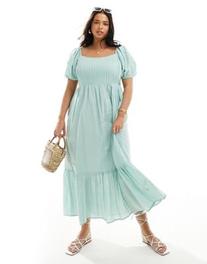 ASOS DESIGN Curve cotton textured midi dress with lace up back in sage offers at $60 in Asos