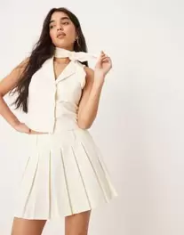 ASOS DESIGN tailored pleated micro skirt in cream offers at $37.99 in Asos