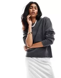 & Other Stories merino wool blend knit sweater with bold shoulder in dark gray offers at $139 in Asos