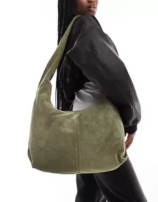 ASOS DESIGN suede sling tote bag in khaki offers at $66.99 in Asos