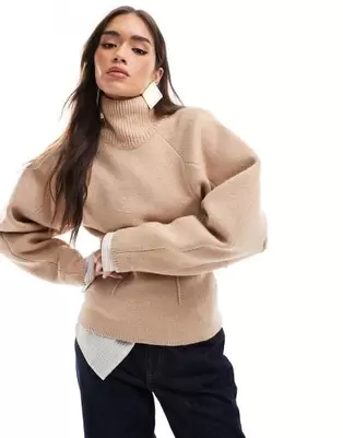 ASOS DESIGN funnel neck sweater with structured sleeve detail in camel offers at $64.99 in Asos