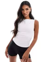 ASOS 4505 Icon soft touch boat neck tank top with shelf bra in white offers at $28 in Asos