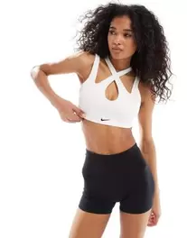 Nike Training Indy freestyle light support sports bra in white offers at $50 in Asos