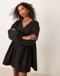 ASOS DESIGN cotton v-neck mini smock dress in black offers at $8 in Asos