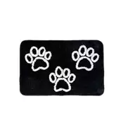 LAUREN TAYLOR DOG PAW PRINT BATH MAT WHITE/BLACK 20X30" offers at $19.99 in Beddington's