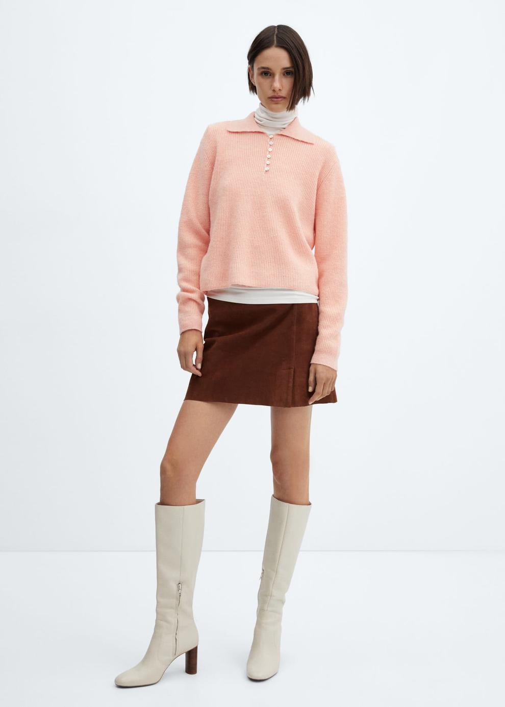 Knitted polo neck sweater offers at $44.99 in Mango
