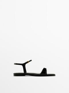 Flat creased patent finish sandals offers at $169 in Massimo Dutti
